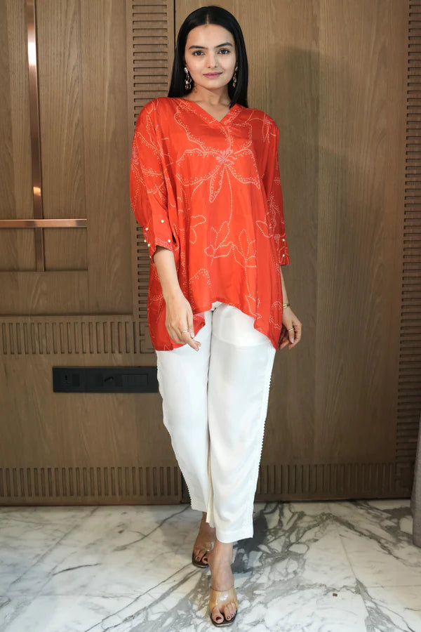Woman wearing a Red Printed Loose Top With White Pant Co-Ord Set