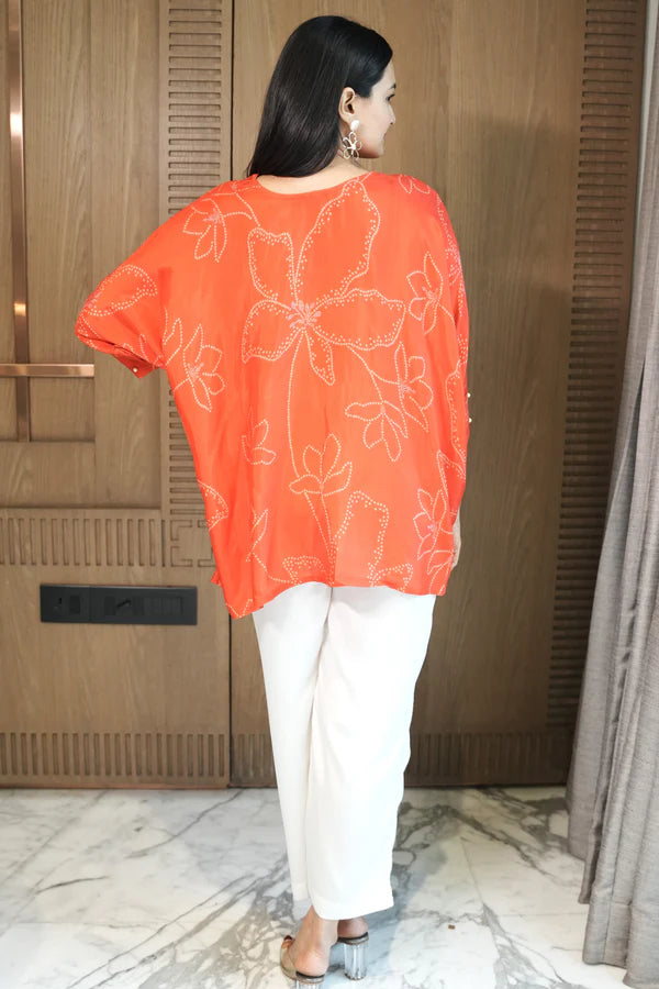 Woman wearing a Red Printed Loose Top With White Pant Co-Ord Set