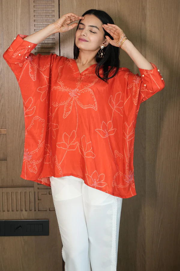 Woman wearing a Red Printed Loose Top With White Pant Co-Ord Set