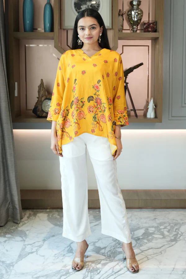 Woman wearing a Yellow Printed Loose Top With Cream Pant Co-Ord Set
