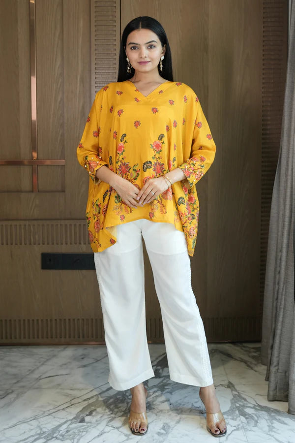 Woman wearing a Yellow Printed Loose Top With Cream Pant Co-Ord 
