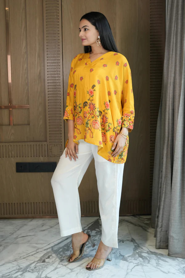 Woman wearing a Yellow Printed Loose Top With Cream Pant Co-Ord 