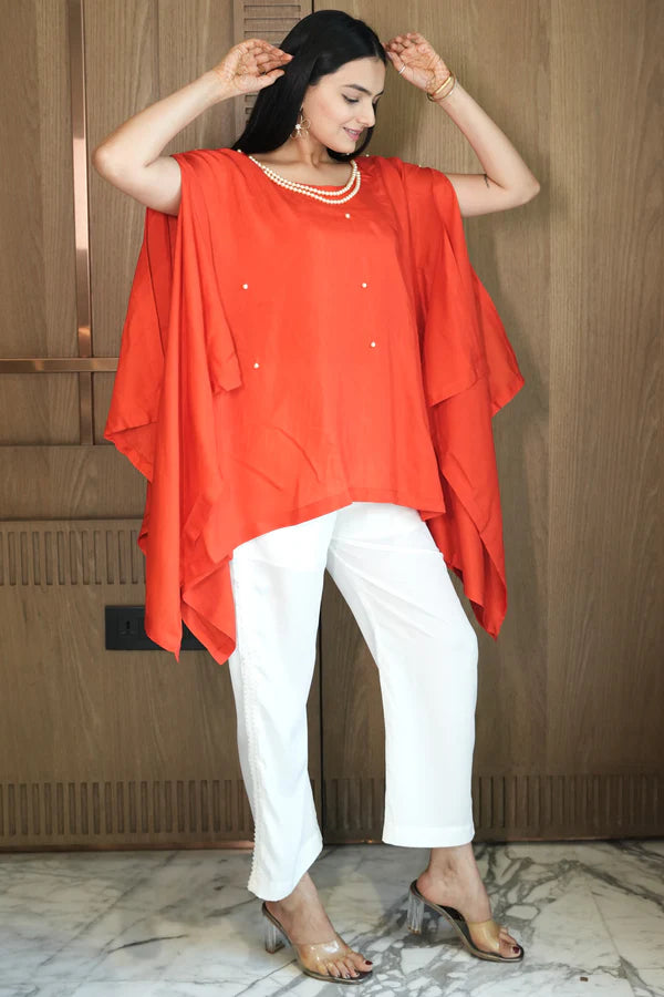 Woman wearing a Red Loose Top With Cream Pant Co-Ord 