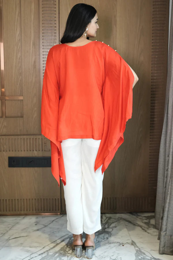 Woman wearing a Red Loose Top With Cream Pant Co-Ord 