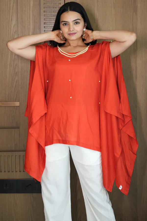 Woman wearing a Red Loose Top With Cream Pant Co-Ord 
