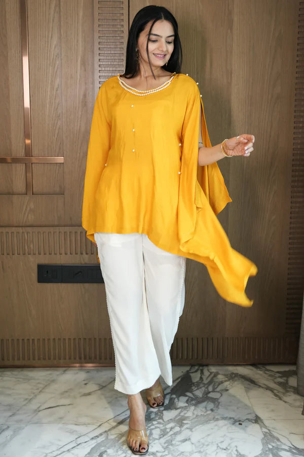 Woman wearing a Yellow Plain Loose Top With White Pant Co-Ord Set