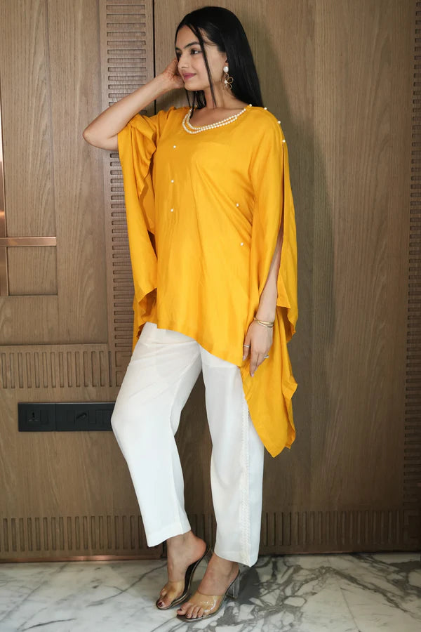 Woman wearing a Yellow Plain Loose Top With White Pant Co-Ord Set