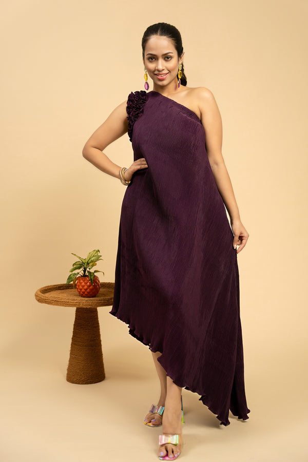 Woman wearing a purple one-shoulder dress 