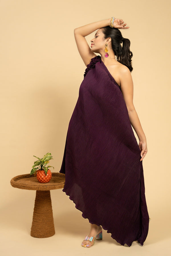 Woman wearing a purple one-shoulder dress 