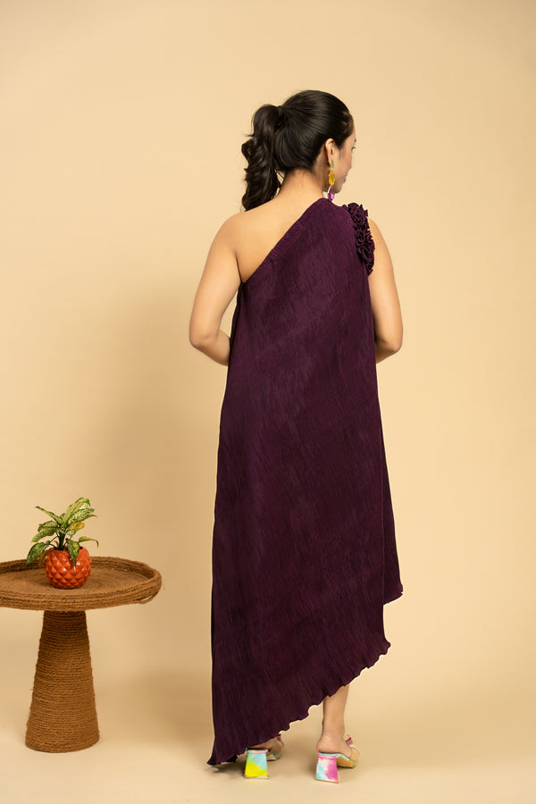 Woman wearing a purple one-shoulder dress 