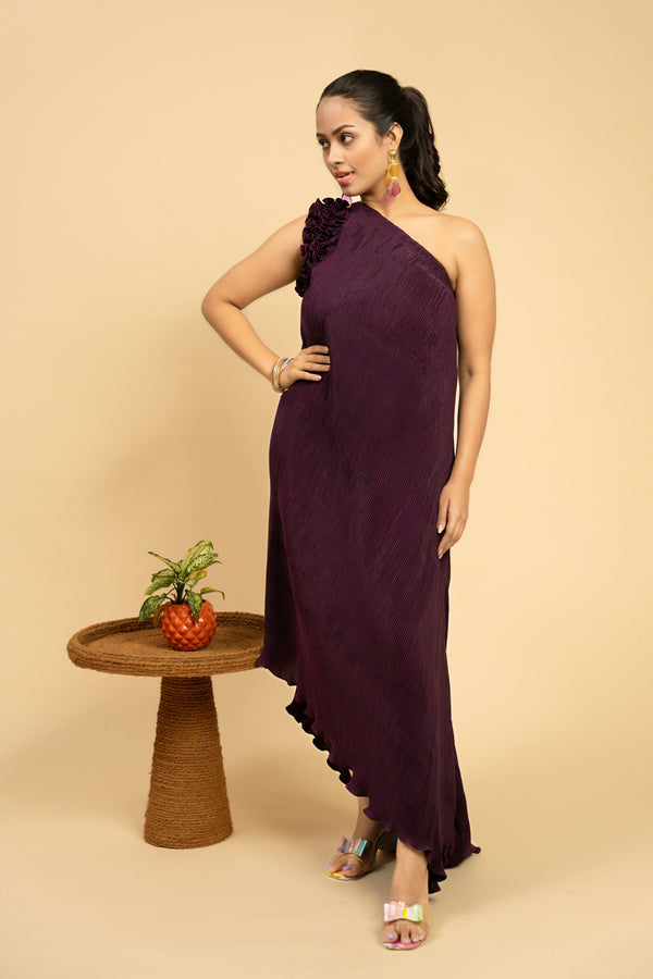 Woman wearing a purple one-shoulder dress 