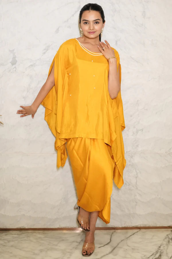 Woman wearing a Mustard Yellow Loose Top With Wrap Round Skirt With Buckle Co-Ord Set