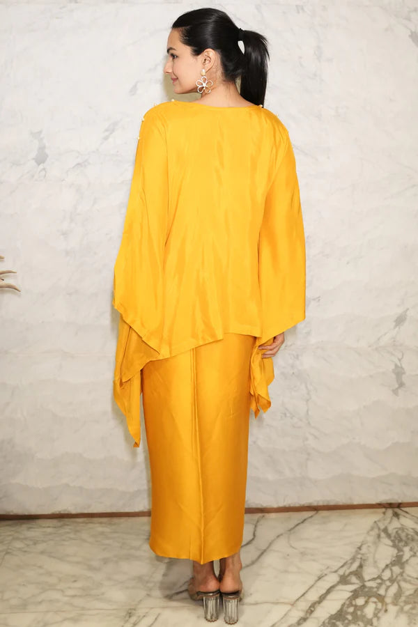 Woman wearing a Mustard Yellow Loose Top With Wrap Round Skirt With Buckle Co-Ord Set