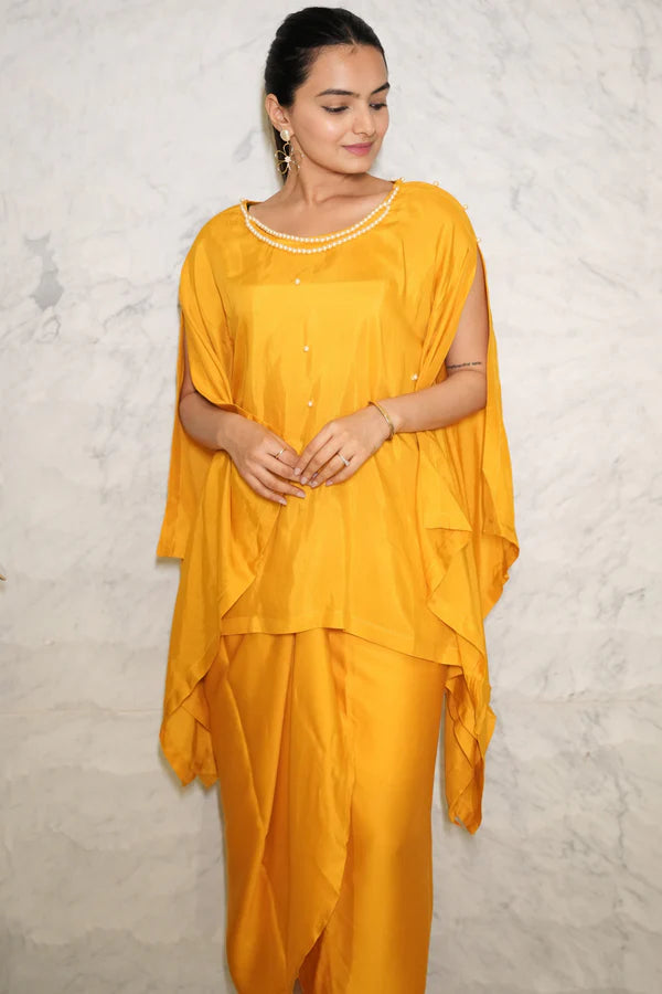 Woman wearing a Mustard Yellow Loose Top With Wrap Round Skirt With Buckle Co-Ord Set