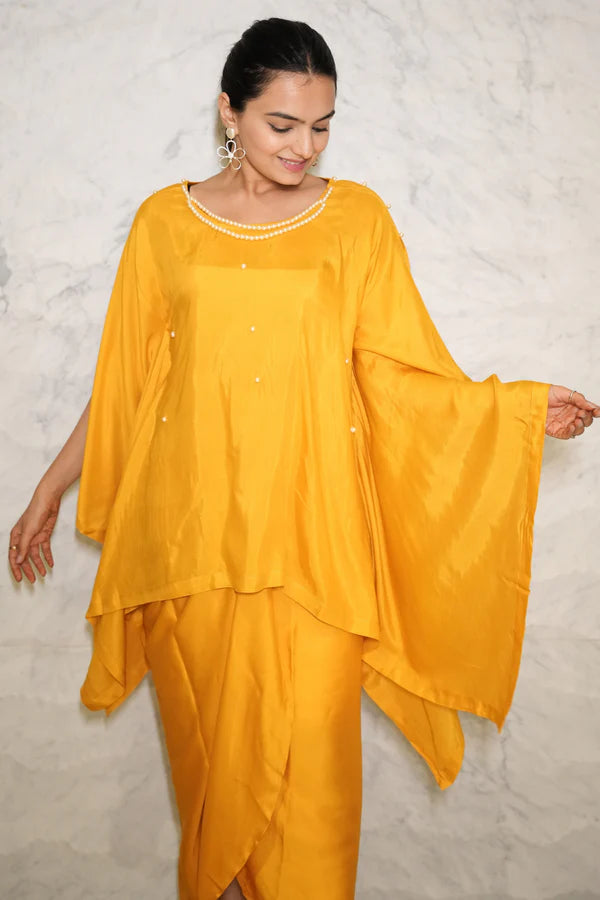 Woman wearing a Mustard Yellow Loose Top With Wrap Round Skirt With Buckle Co-Ord Set