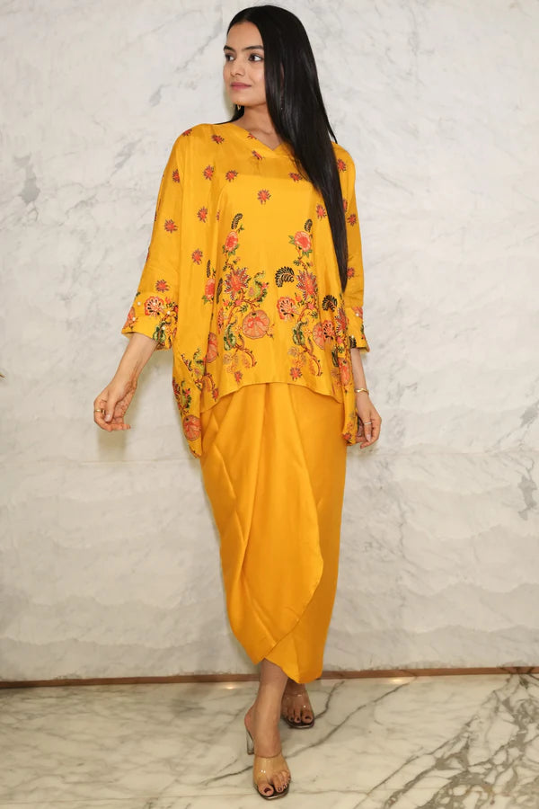 Woman wearing a Mustard yellow floral  printed Loose top With Wrap Round Skirt With Buckle Co-Ord Set