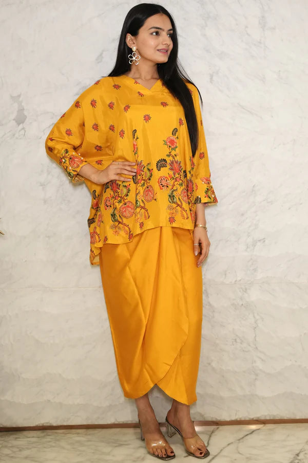 Woman wearing a Mustard yellow floral  printed Loose top With Wrap Round Skirt With Buckle Co-Ord Set
