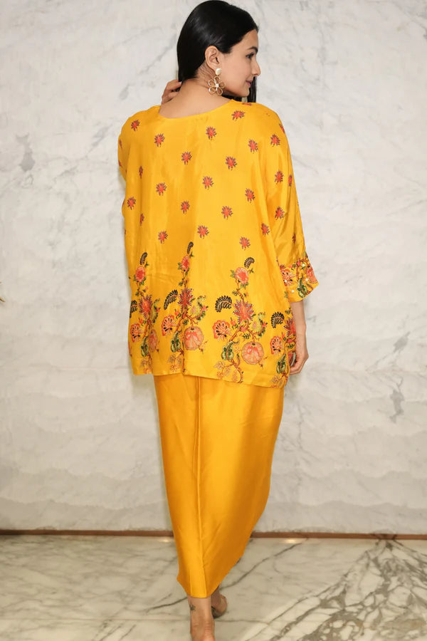 Woman wearing a Mustard yellow floral  printed Loose top With Wrap Round Skirt With Buckle Co-Ord Set