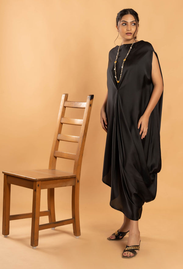 Woman wearing a Black Cowl dress 