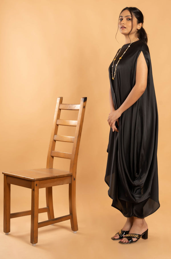 Woman wearing a Black Cowl dress 