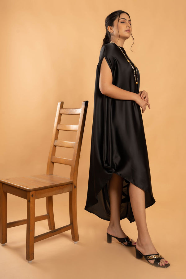 Woman wearing a Black Cowl dress 