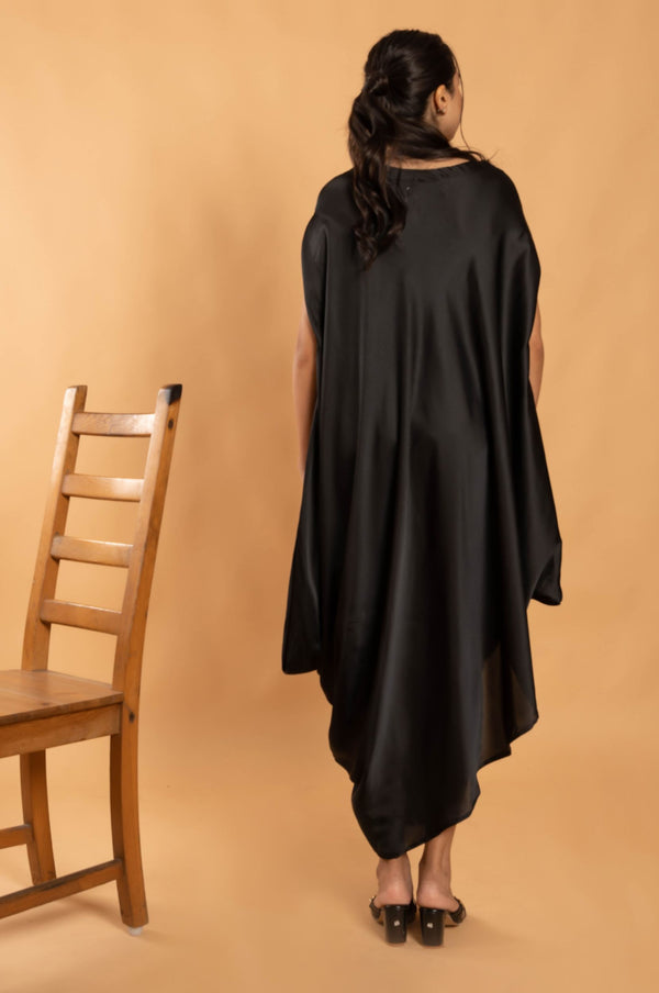 Woman wearing a Black Cowl dress 