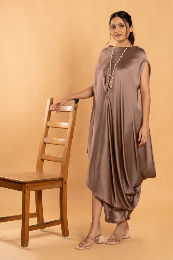 Woman wearing a Copper Cowl dress 