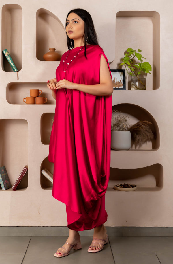 Woman wearing a Pink Cowl dress 