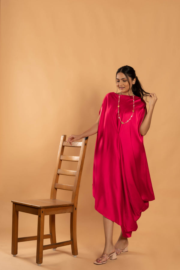 Woman wearing a Pink Cowl dress 