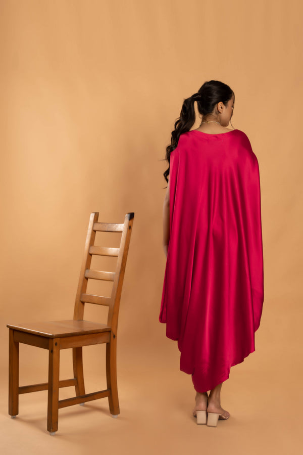 Woman wearing a Pink Cowl dress 