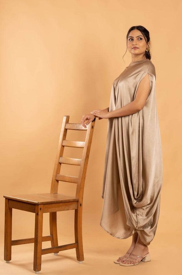 Woman wearing a Gold Cowl dress 