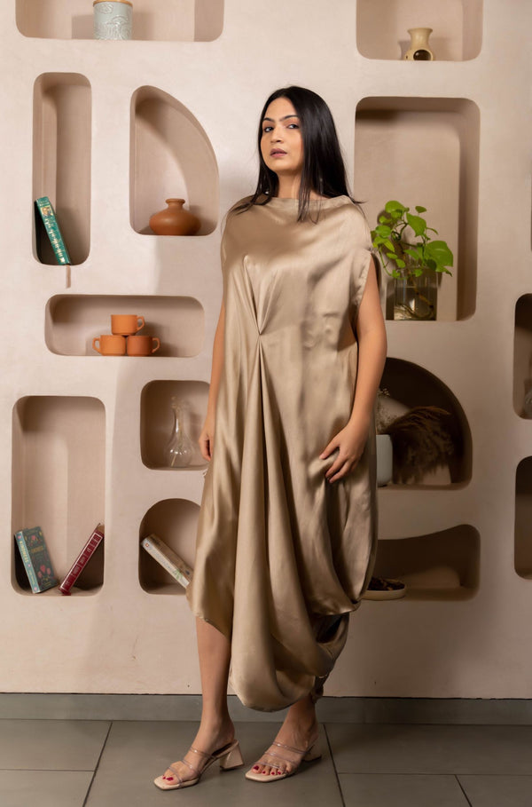 Woman wearing a Gold Cowl dress 