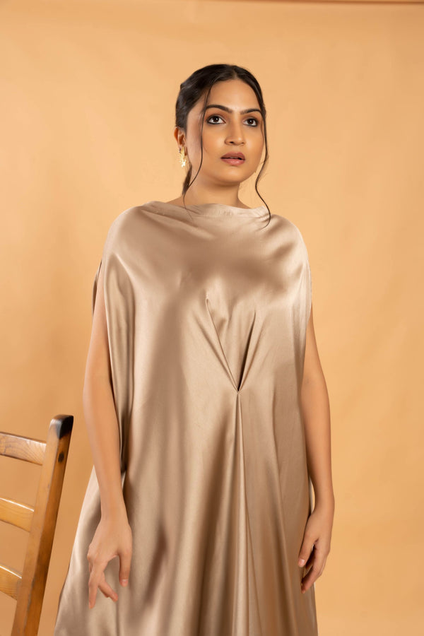 Woman wearing a Gold Cowl dress 