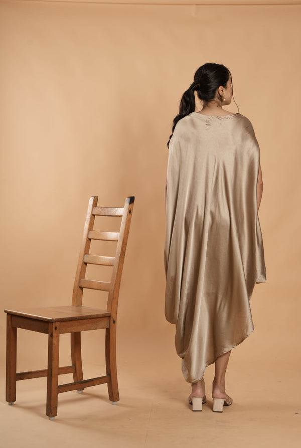 Woman wearing a Gold Cowl dress 