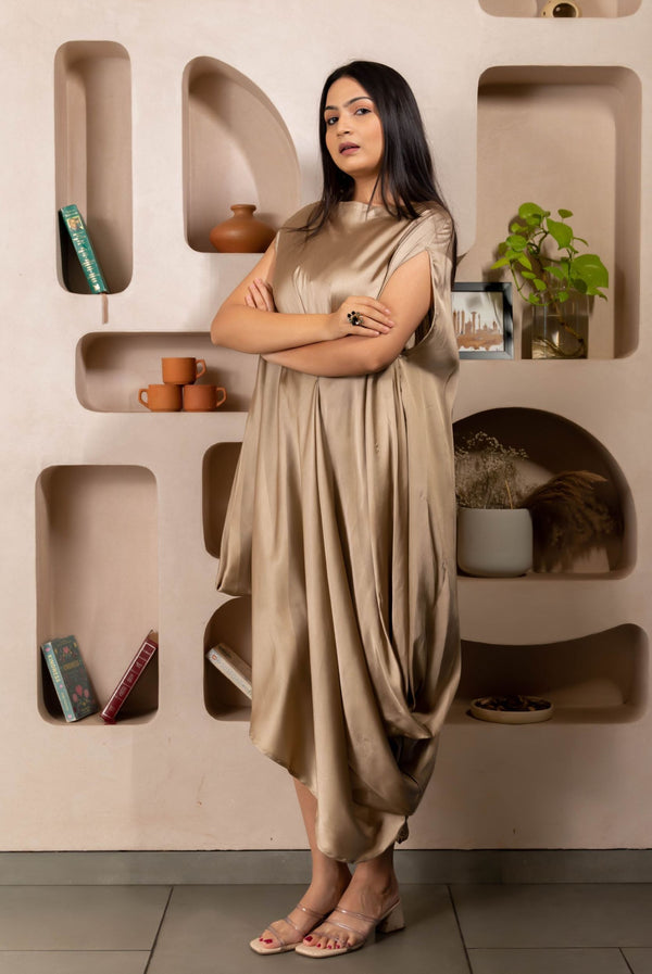 Woman wearing a Gold Cowl dress 