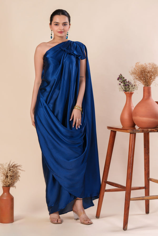 Woman wearing a blue one-shoulder dress 