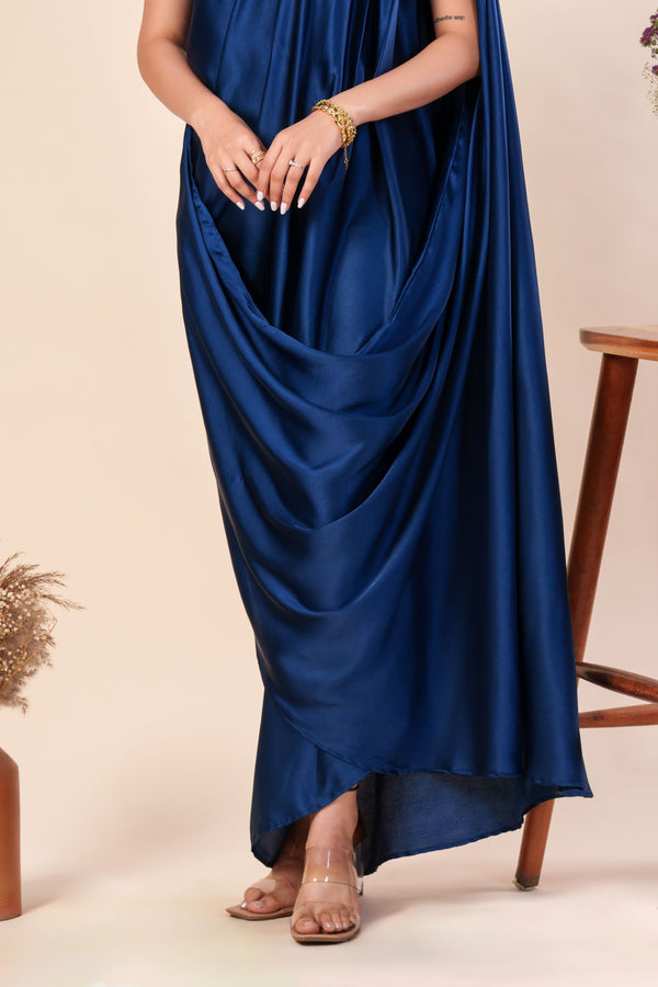 Woman wearing a blue one-shoulder dress 