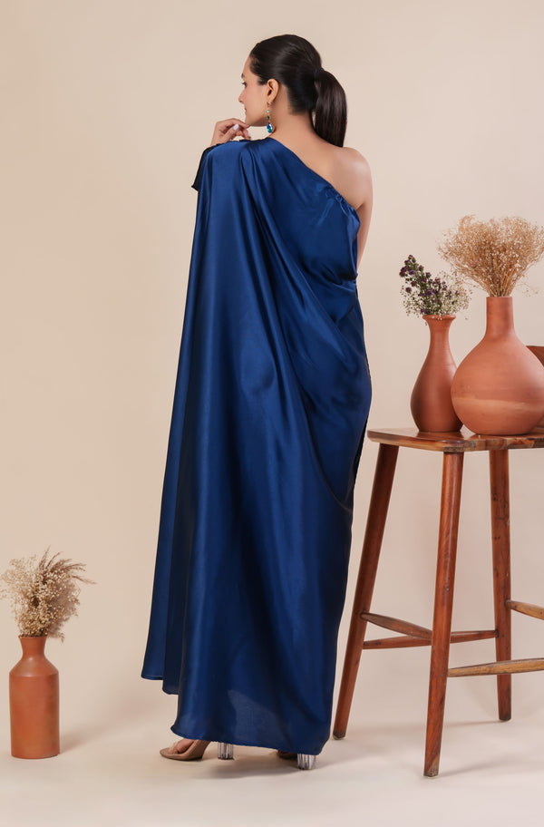 Woman wearing a blue one-shoulder dress 