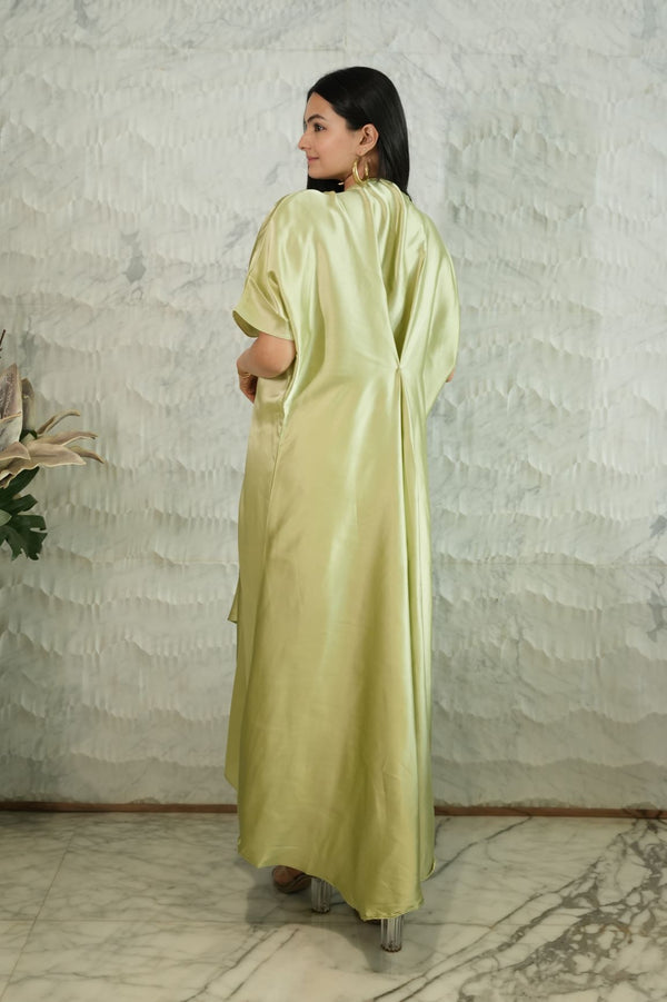 Woman wearing a light green Kaftan dress 